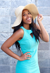 Beautiful african american woman smiling with sun hat