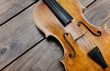 Violin on a wooden background
