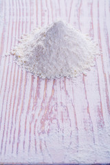 little pile of flour on old white desk