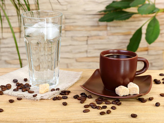 Cup of black coffee and a glass of cold water