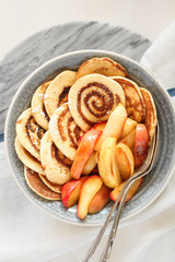 Cinnamon Roll Pancakes with Caramelized Apples