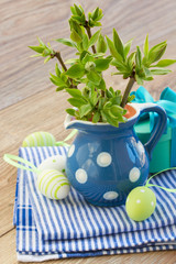 green tree twigs and easter eggs