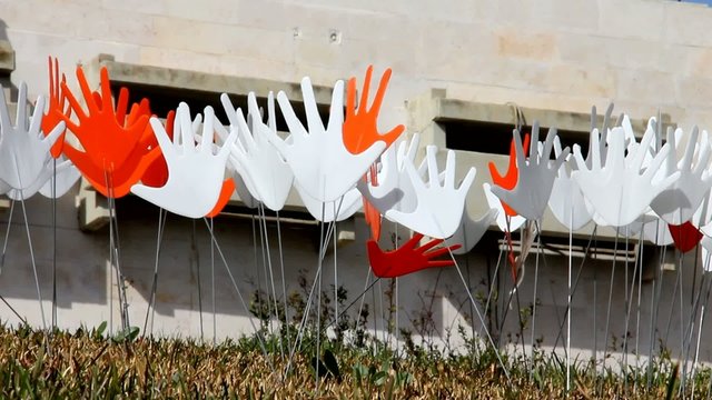 Many waving abstract hands signs or flags