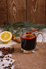 Mulled wine, punch and spices for glintwine on wooden background