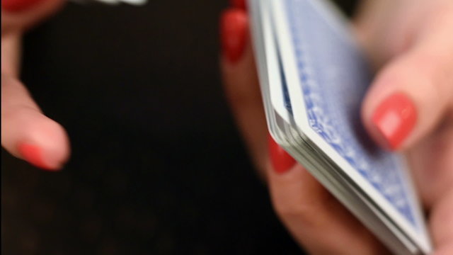 croupier shuffling cards, close up