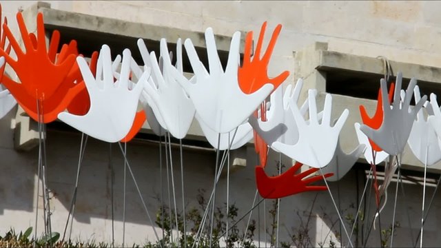 Many waving abstract hands signs or flags