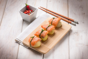 homemade sushi with potatoes and fresh salmon