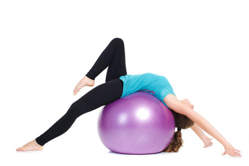 Fototapeta na wymiar Girl-fitness instructor,shows exercises with a large ball.