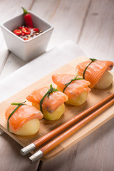 homemade sushi with potatoes and fresh salmon, selective focus