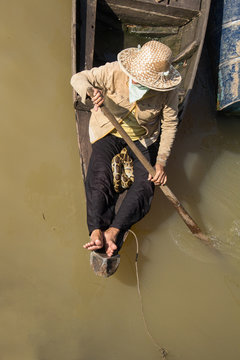Women with snake on boat - Travel Asia