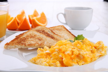 breakfast with scrambled eggs and orange juice