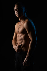 strong sexy man on  black background