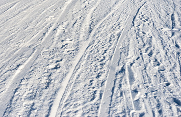 Closeup photo of skis marks on snow slope