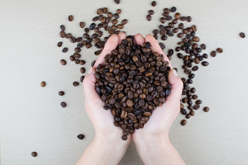 coffee in hand on gray background
