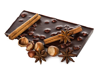 Chocolate and nuts with cinnamon sticks, star anise isolated