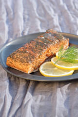 Smoked salmon with slices of lemon and dill.