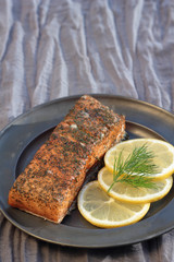 Smoked salmon with slices of lemon and dill.
