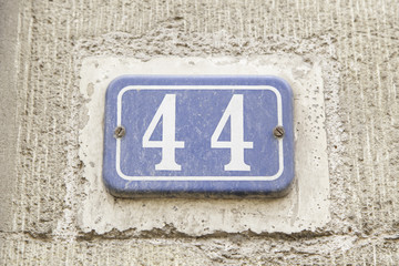 Number forty-four on the wall of a house