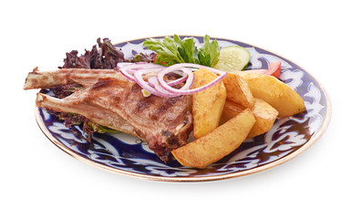 Meat on a grill with vegetables