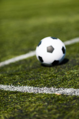 Soccer ball on artificial pitch
