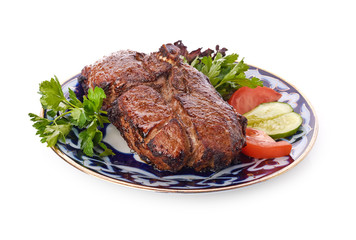 Meat on a grill with vegetables