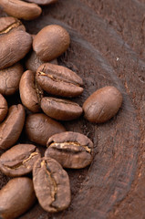 Coffee beans on wood background