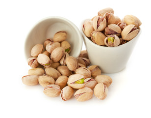 Heap of pistachios nuts isolated on the white