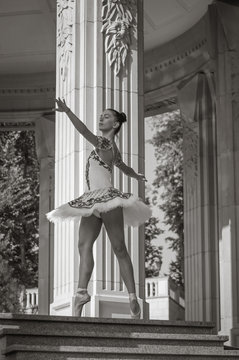 Beautiful young ballerina dancing, standing in pointe position.
