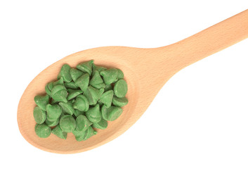 mint nipple chips on wooden spoon isolated on white