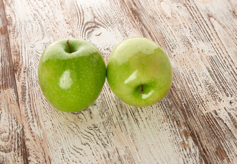 green apple on wooden background