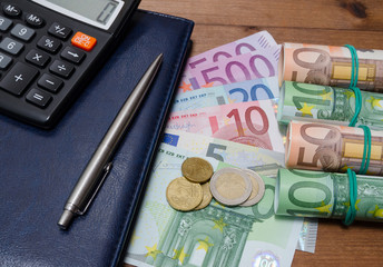 Money, notepad and calculator