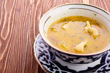 Bowl of chicken soup with vegetables and noodles