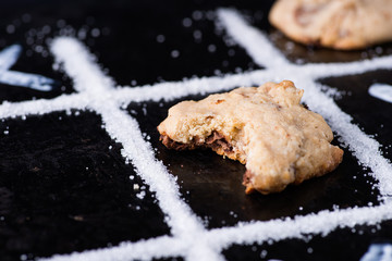 Chocolate chip cookies on noughts and crosses sugar grid