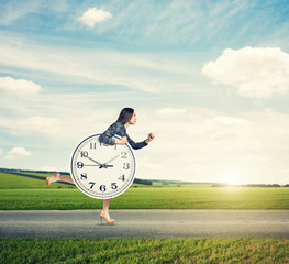 woman holding big clock