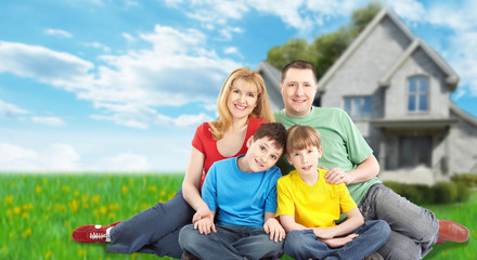 Fototapeta premium Happy family near new house.