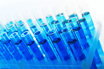 Test-tubes with blue fluid, close-up