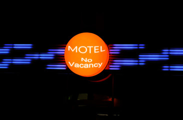 Motel sign on building at night