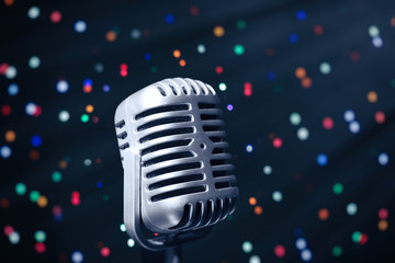 Retro microphone on bright background, Karaoke concept