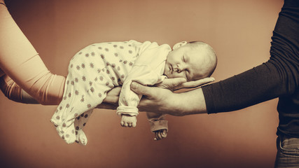 newborn baby girl in the comfort of moms arms