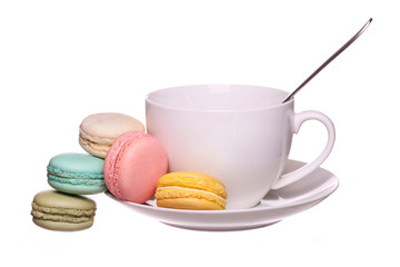 Fototapeta na wymiar Colorful French Macaroons with Cup of Tea isolated on white