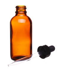 Brown medicine glass bottle with dropper isolated over white