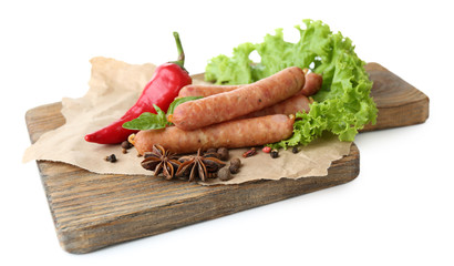 Smoked thin sausages  with lettuce salad leaves and spices