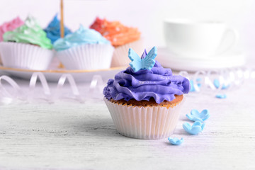 Delicious cupcakes on table close-up
