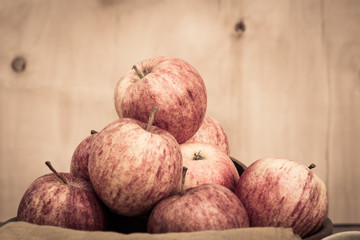 Group of organic apples on vintage background