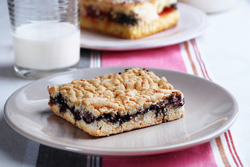 Homemade pies with jam and glass of milk