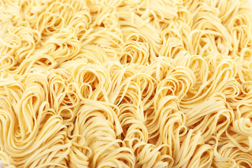 Different dry instant noodles close-up background