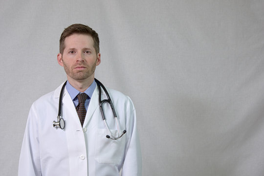 Serious Doctor with White Coat and Stethoscope