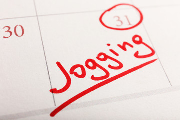 Written plan Jogging on calendar page background