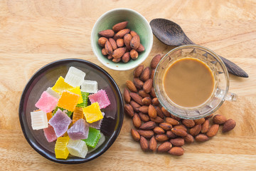 Almonds,colorful dessert and hot coffee for healthy