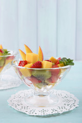 Fruit salad with mint in glassware